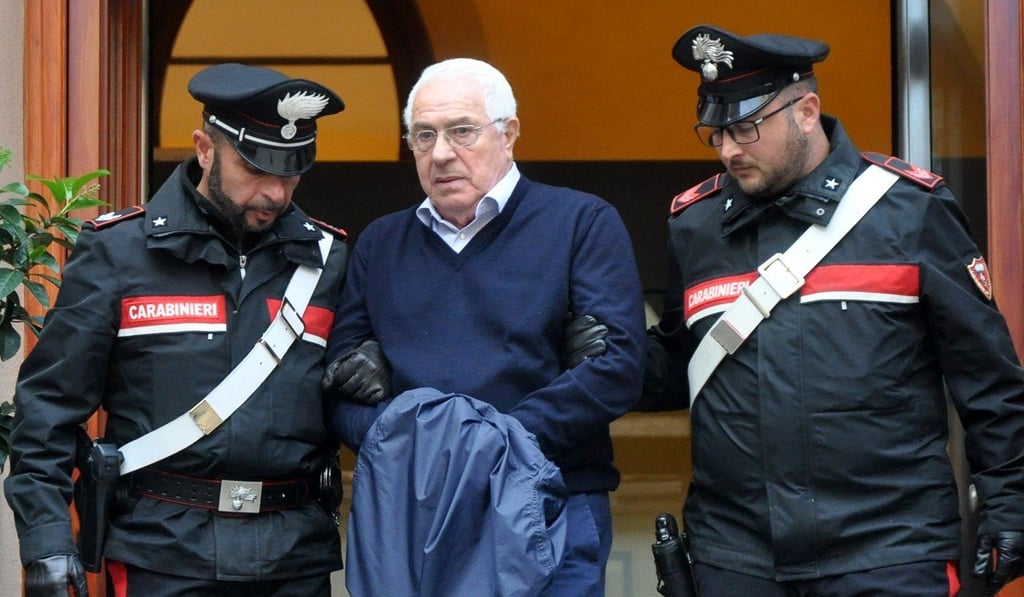 Settimino Mineo is escorted by Palermo police after his arrest. Photo: Alessandro Fucarini