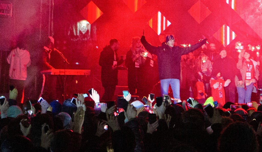 A man holding a knife shouts on stage just after Pawel Adamowicz was stabbed during the open-air finale of a Christmas charity in Gdansk, Poland on Sunday. Photo: Reuters