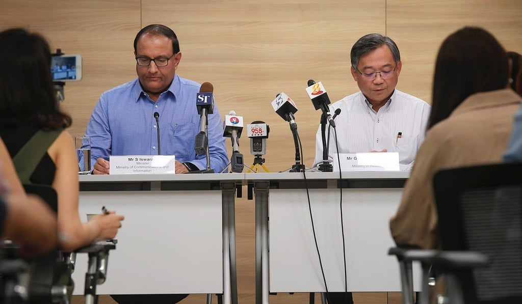 Singapore’s Minister for Communication and Information S Iswaran (left) and Minister of Health Gan Kim Yong (right) at a press conference about a breach of health data, 20 July 2018. Photo: EPA