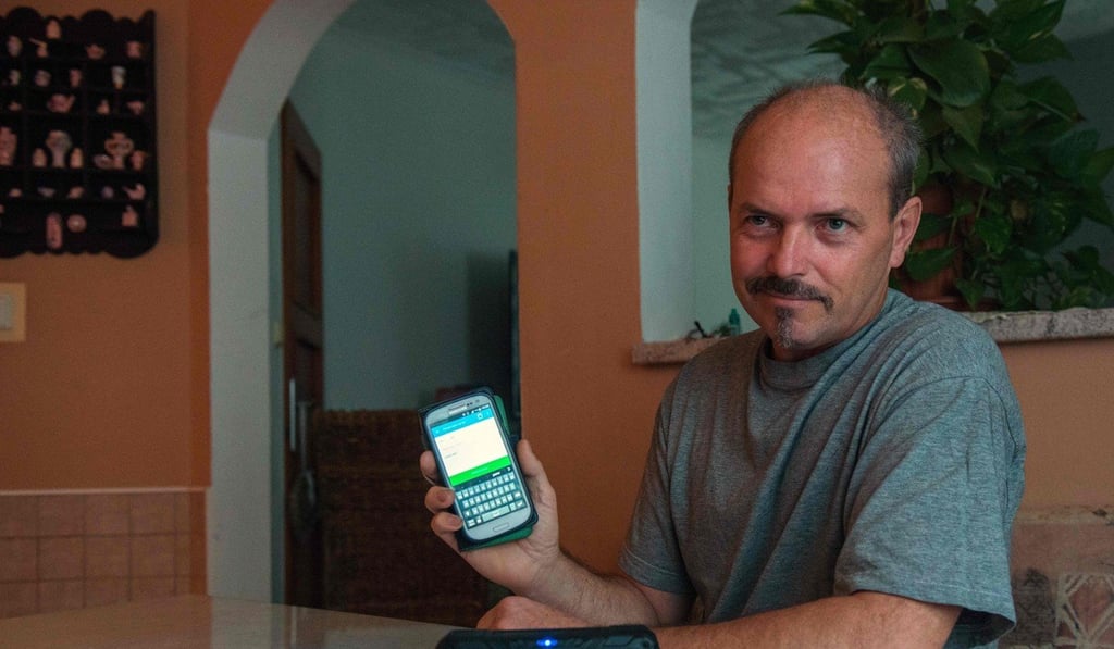 Vlastimil Gular, who lost his larynx and his voice, speaks in his own voice via a mobile phone using the special app. Photo: AFP Vlastimil Gular, who lost his larynx and his voice, speaks in his own voice via a mobile phone using the special app. Photo: AFP