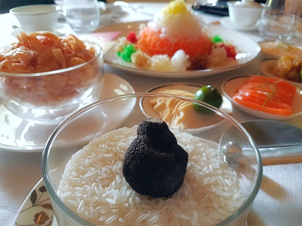 A version of the traditional yusheng, with abalone slices, salmon and lobster sashimi, as well as fresh black truffles, served at Cassia, at Cappella Singapore. A version of the traditional yusheng, with abalone slices, salmon and lobster sashimi, as well as fresh black truffles, served at Cassia, at Cappella Singapore.