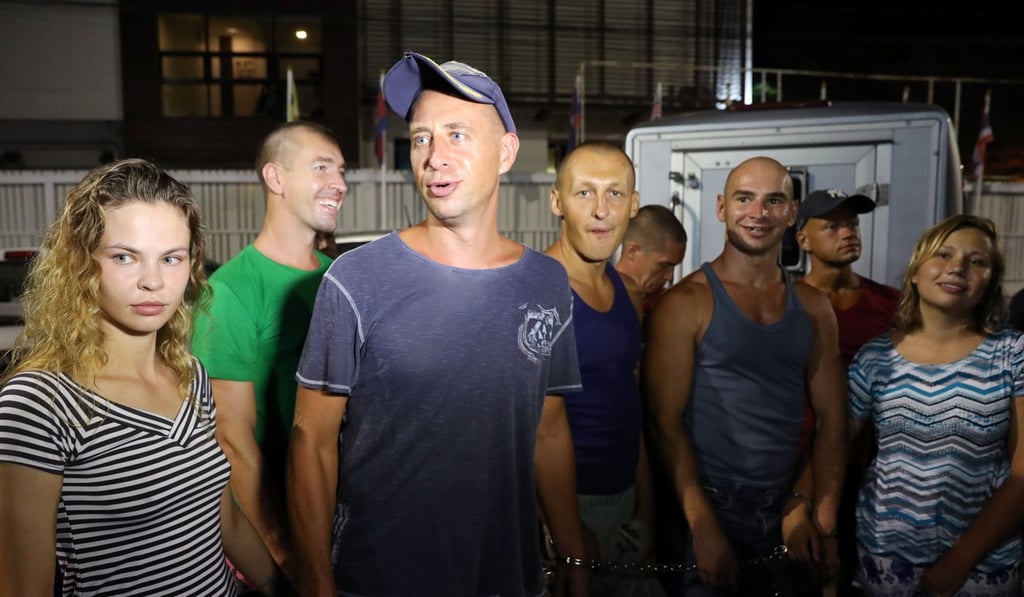 Anastasia Vashukevich (left), a Belarusian model and “sex trainer”, is pictured with co-defendants at Chonburi Immigration Centre in Pattaya, Thailand, on Tuesday. She was set to be deported after pleading guilty to soliciting. Photo: Reuters