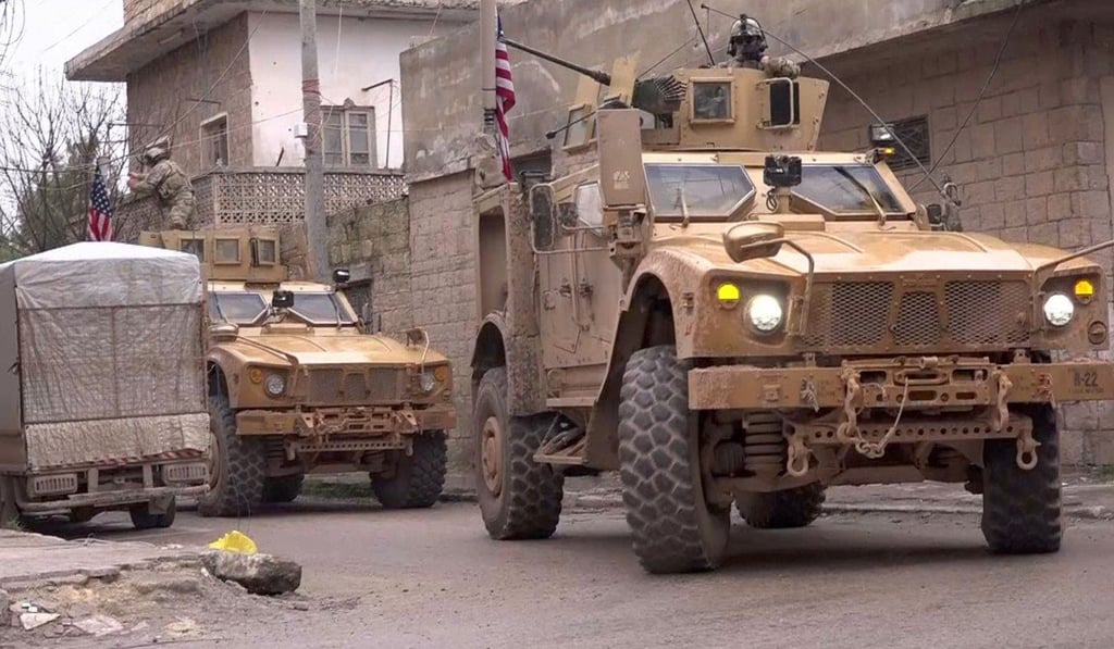 An image grab taken from a video obtained by AFPTV on Wednesday shows US armoured vehicles at the scene of a suicide attack in the northern Syrian town of Manbij. Photo: Agence France-Presse