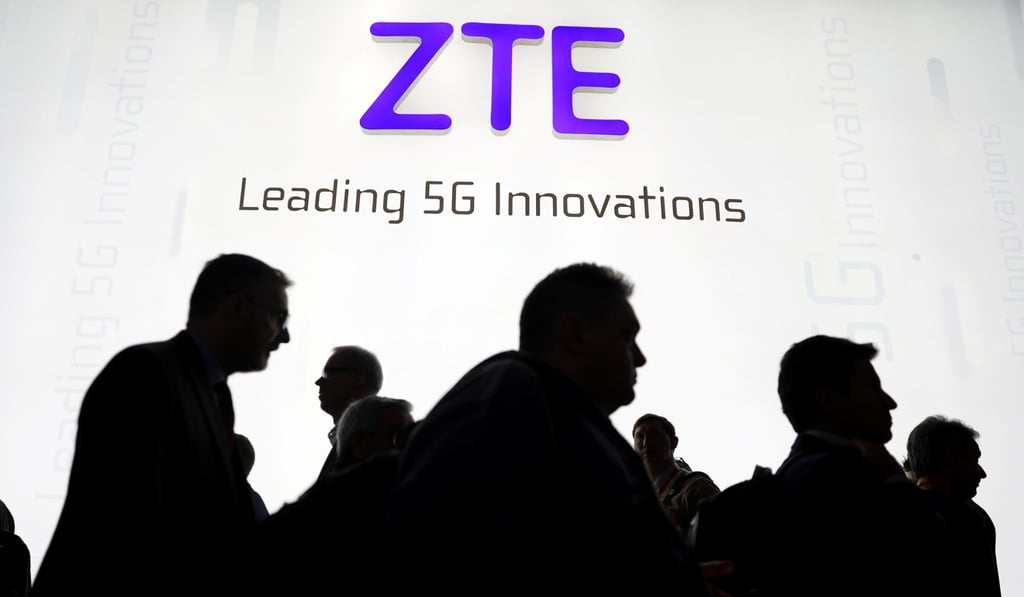 Visitors pass in front of the ZTE booth at the Mobile World Congress in Barcelona, Spain, in this February 2018 file photo. Photo: Reuters
