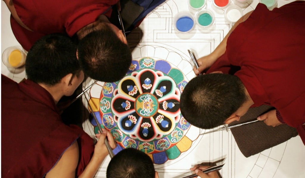 Tibetan Buddhist monks from the Drepung Gomang Monastery, where Kelden studied, working on a sand mandala at the Chicago Cultural Center. Picture: AP