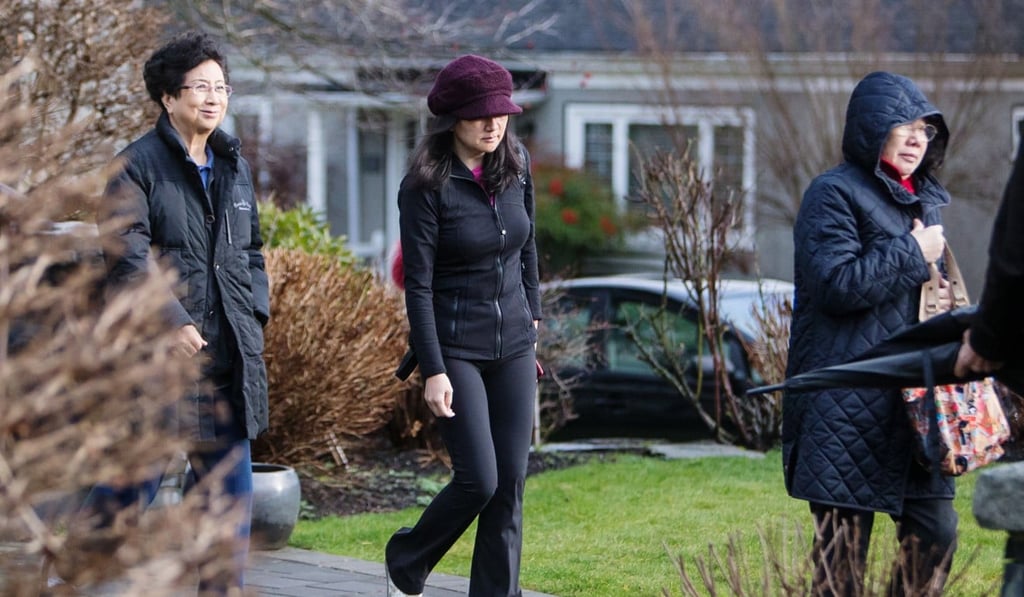 Sabrina Meng Wanzhou (centre), chief financial officer of Huawei Technologies, leaves her home while out on bail in Vancouver, Canada, last Thursday. Photo: Bloomberg Sabrina Meng Wanzhou (centre), chief financial officer of Huawei Technologies, leaves her home while out on bail in Vancouver, Canada, last Thursday. Photo: Bloomberg
