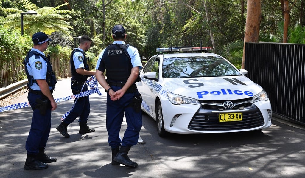 New South Wales police stand guard at the scene of a double stabbing at the Church of Scientology headquarters in Chatswood, Sydney on January 3. Photo: EPA New South Wales police stand guard at the scene of a double stabbing at the Church of Scientology headquarters in Chatswood, Sydney on January 3. Photo: EPA