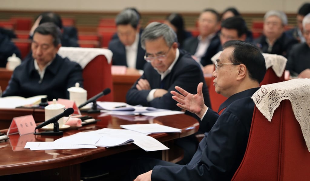 Premier Li Keqiang presides over a Beijing symposium where he hears views and recommendations made by scholars and entrepreneurs on a draft version of the government work report. Photo: www.gov.cn