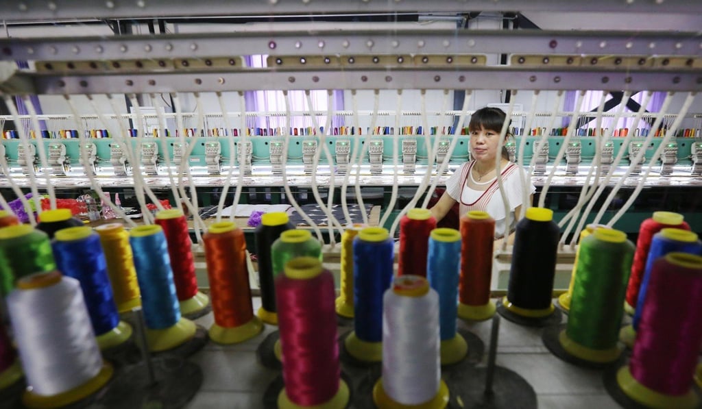 A woman works on a toy company’s production line in Wuzhi county, Henan province. Photo: Xinhua