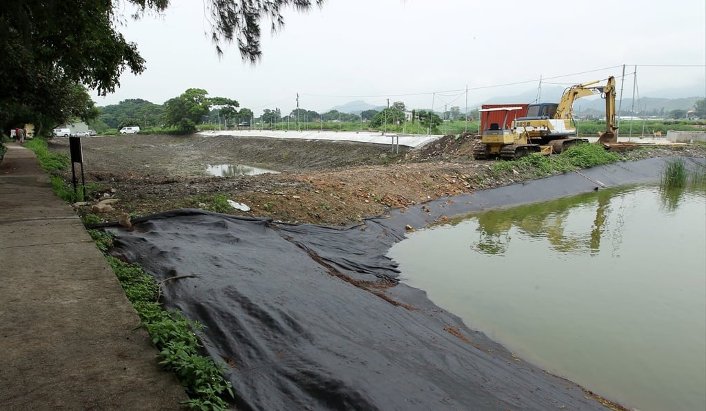 Fish ponds next to the Mai Po nature reserve. In the conservation area, new developments are not allowed unless they support the aims of conservation. Thus some limited private developments may be permitted in return for the better management of the remaining fish ponds. Photo: Nora Tam