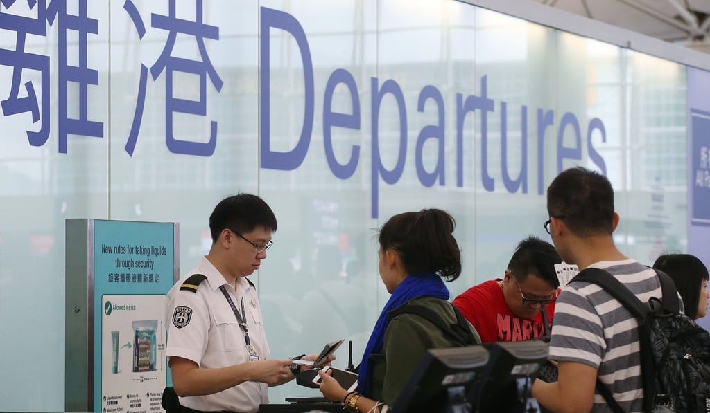 Passengers line up at the departures lobby at Hong Kong International Airport. People travelling with a Hong Kong passport have visa-free access to 169 countries. Photo: David Wong