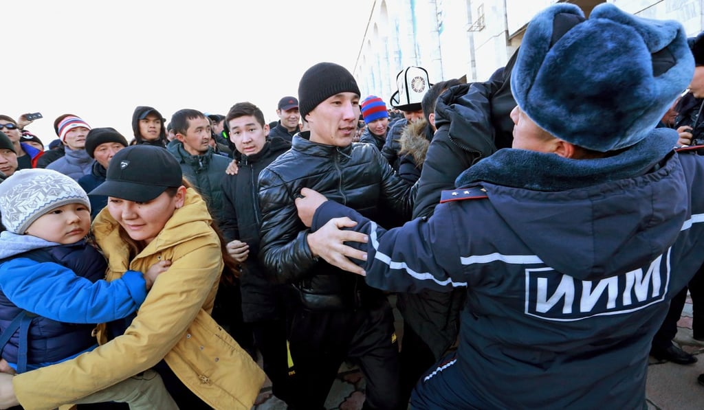 A Kyrgyz security official scuffles with protesters in an anti-Chinese rally on Ala-Too Square in the centre of Bishkek, Kyrgyzstan, on Thursday. Photo: EPA A Kyrgyz security official scuffles with protesters in an anti-Chinese rally on Ala-Too Square in the centre of Bishkek, Kyrgyzstan, on Thursday. Photo: EPA