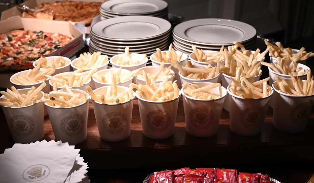French fries and pizza are among fast food items for the Clemson Tigers in the State Dining Room of the White House. Photo: AP/Susan Walsh