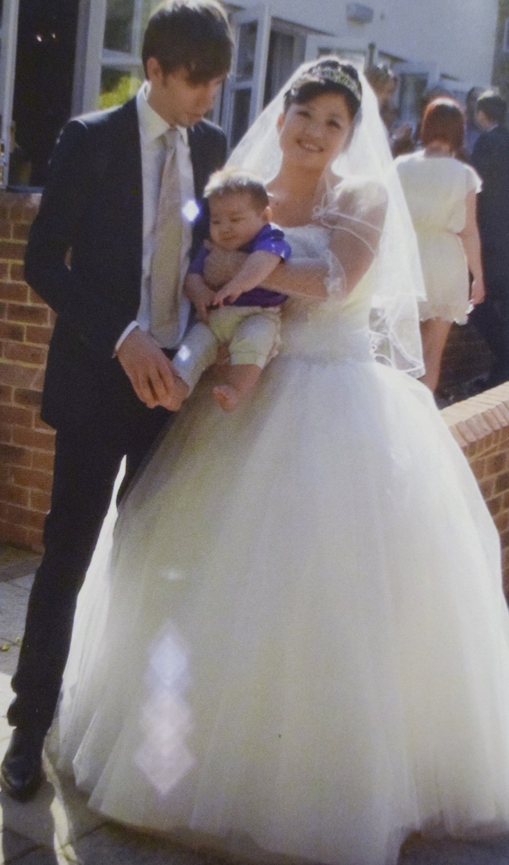 Michael and Fu Weiwei, with Jack, on their wedding day, in 2010. Picture: Red Door News