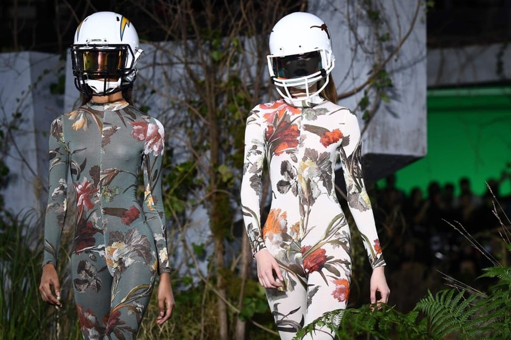 Jungle-print bodysuits were accessorised with football helmets. Photo: AFP