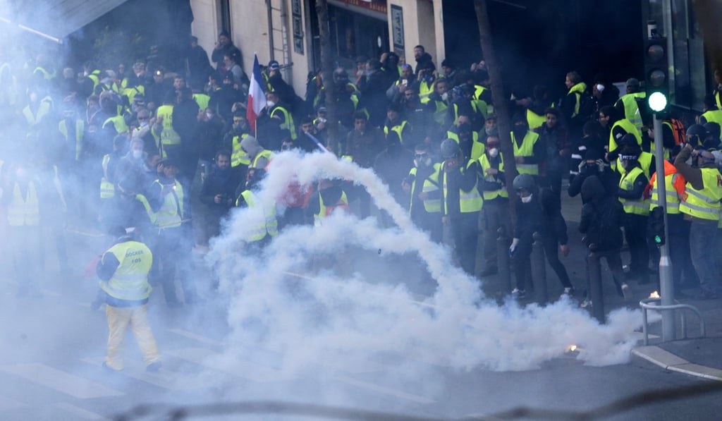 Demonstrators enveloped by tear gas during a protest in Marseille on Saturday. Photo: AP