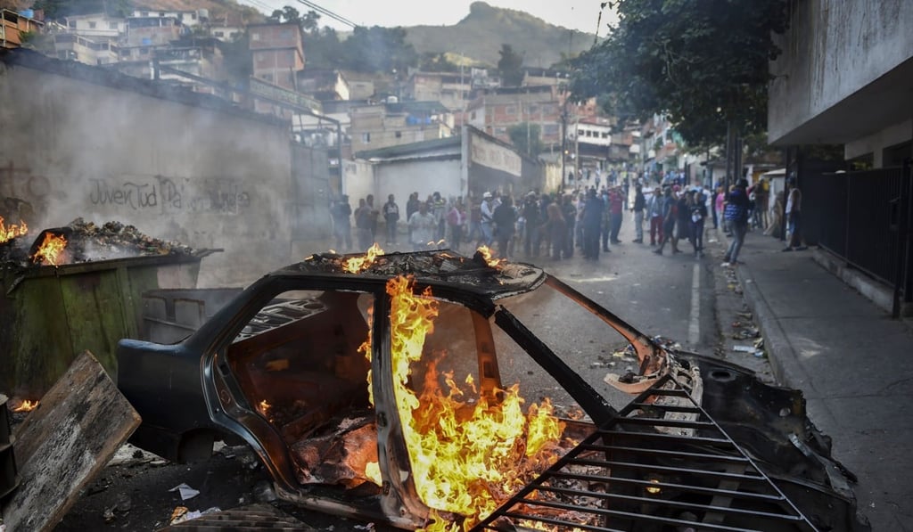 Protesters demonstrate in front of the Cotiza Bolivarian National Guard headquarters in Caracas on Monday. Photo: AFP