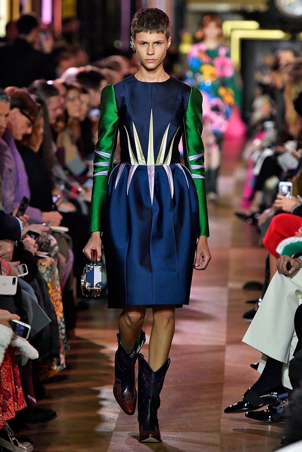 Cowboy boots were worn with a medieval mini dress and Juliet sleeves. Photo: Xinhua