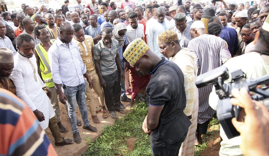 Mourners bury the body of Ahmed Hussein-Suale in Accra, Ghana. Photo: AP Mourners bury the body of Ahmed Hussein-Suale in Accra, Ghana. Photo: AP