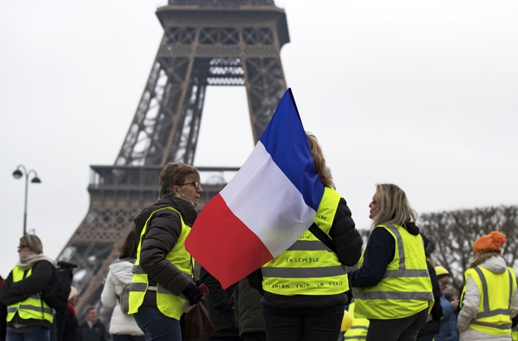 A Women’s gilets jaunes (yellow vests) protest in front of the Eiffel Tower, in Paris. Photo: EPA-EFE