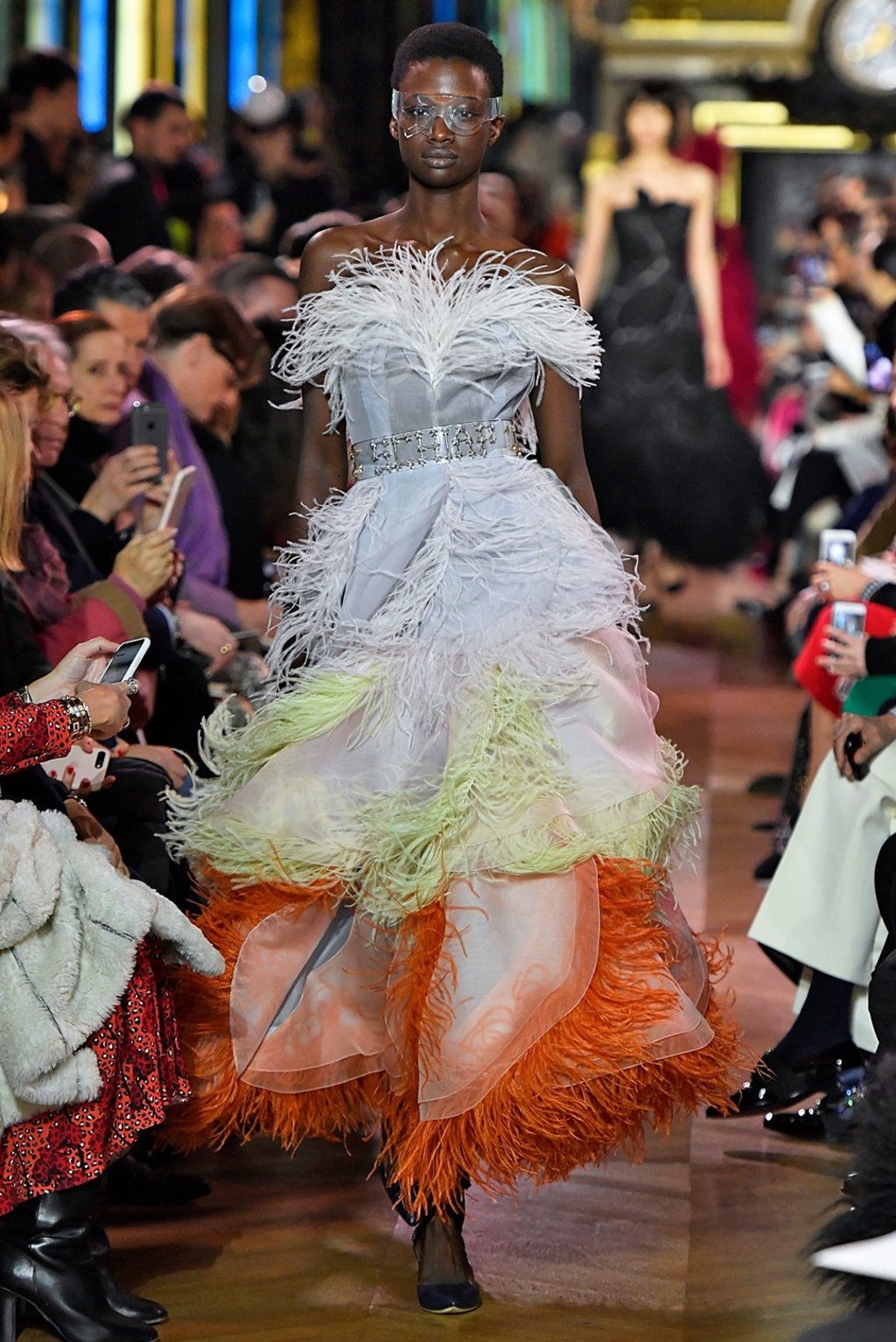 Coloured feathers embellished several dresses in the collection. Photo: Xinhua