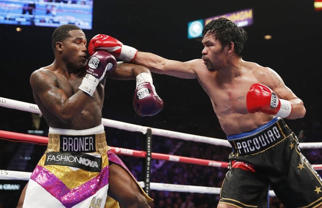 Manny Pacquiao throws a punch at Adrien Broner. Photo: AP Manny Pacquiao throws a punch at Adrien Broner. Photo: AP