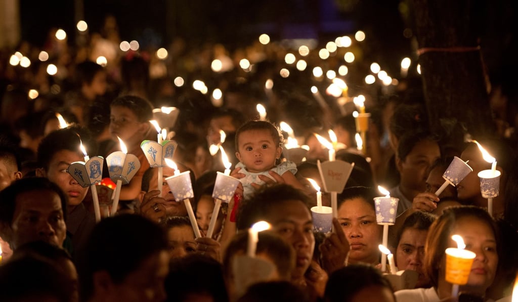 Roman Catholic devotees attend a mass in celebration of Easter in 2014. Photo: AFP