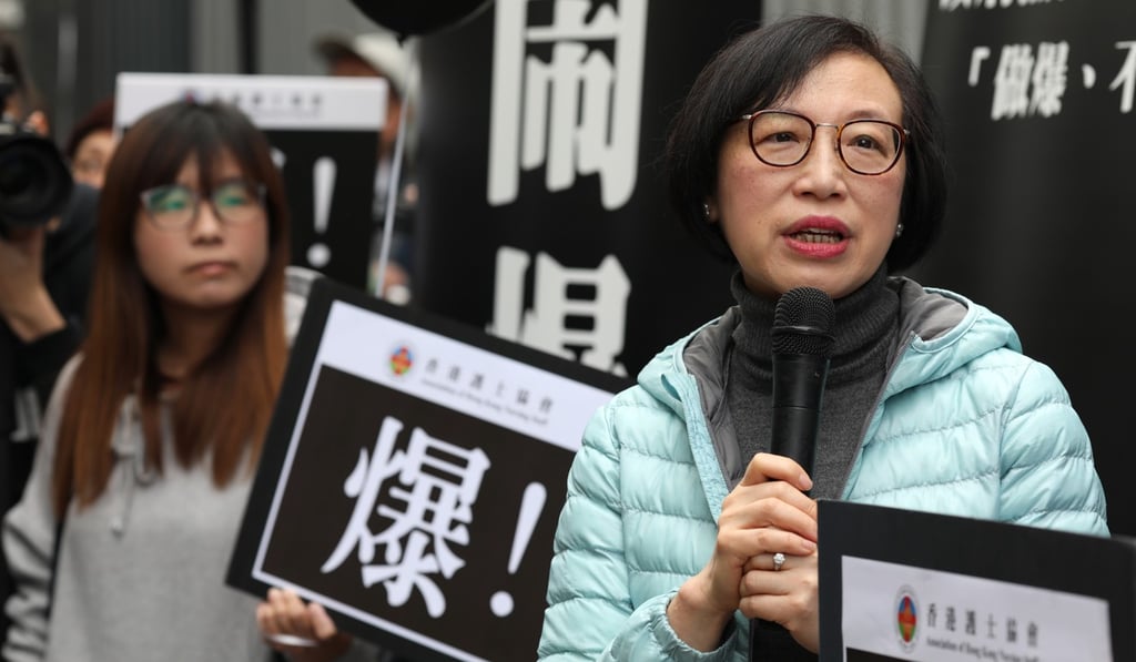 Health secretary Sophia Chan (right) addresses the protesters. Photo: Robert Ng