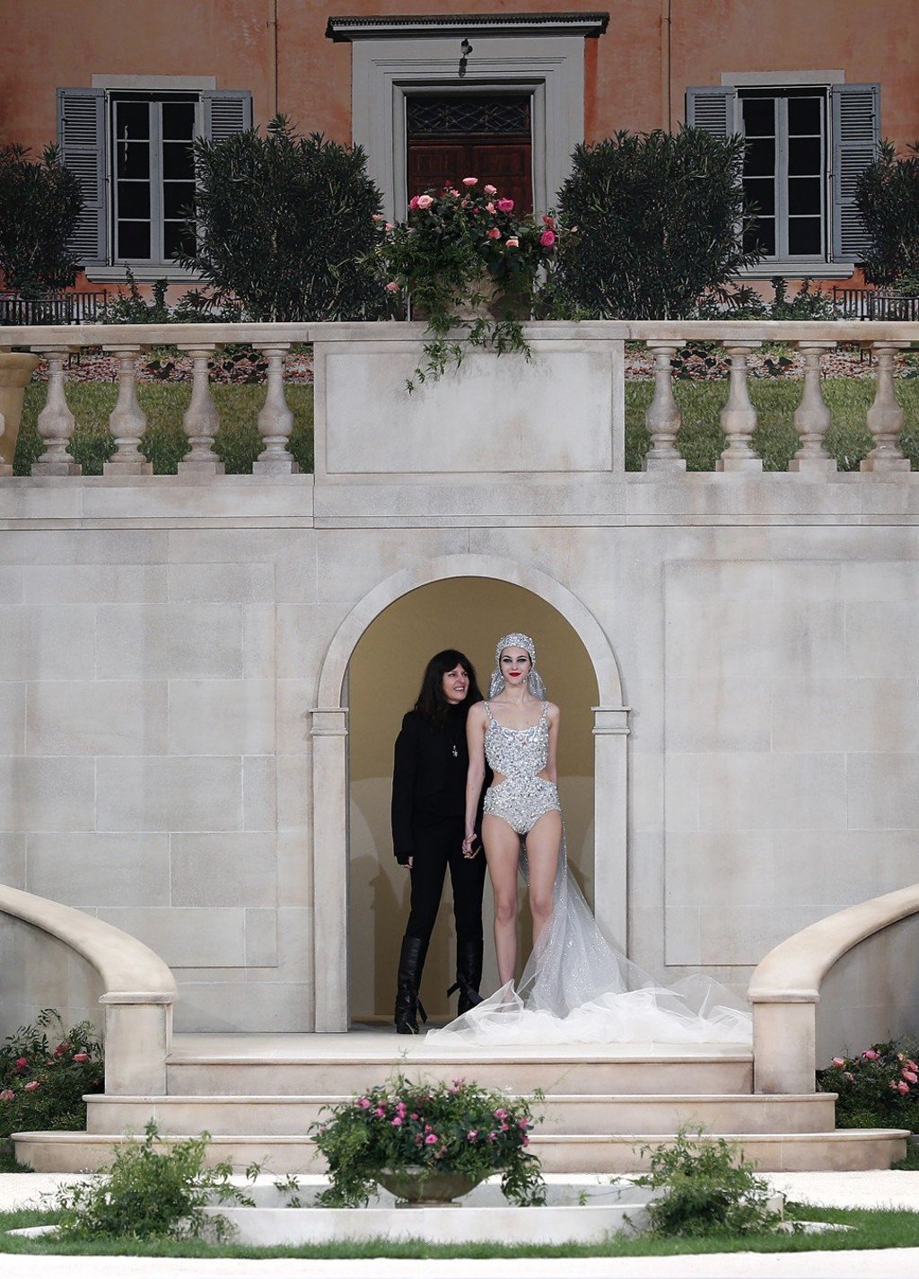 Fashion studio director Virginie Viard (left) acknowledges the audience with a model after presenting Karl Lagerfeld’s spring/summer 2019 collection for Chanel at Paris Haute Couture 2019. Photo: EPA-EFE