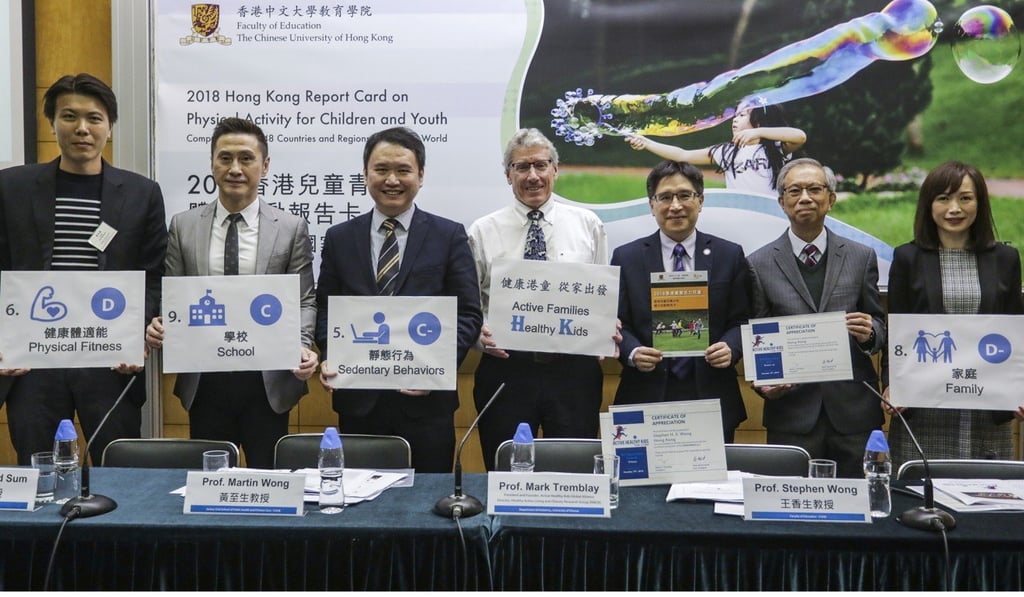 Mark Tremblay (centre), Stephen Wong (third right) and fellow academics release the study findings. Photo: Tory Ho