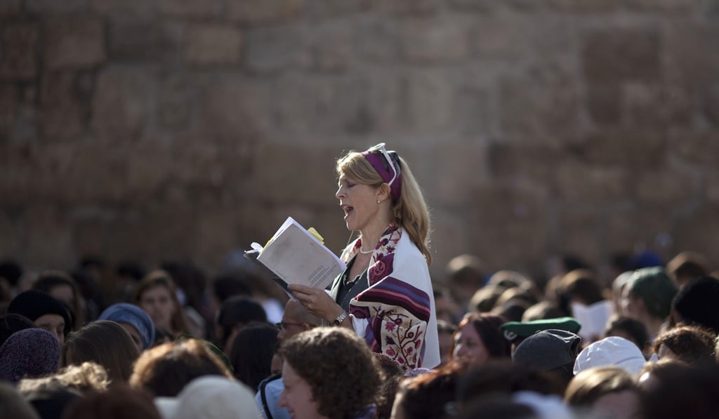 A Jewish woman prays at the Western Wall in November 2013. In 2017, Israeli Prime Minister Benjamin Netanyahu reneged on a plan to allow men and women to pray together at a section of the wall. Photo: AP