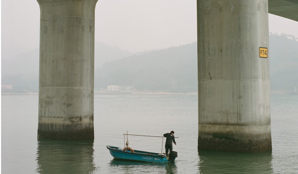 A fisherman pictured below the Hong-Kong-Zhuhai-Macau Bridge. Photo: Abdela Igmirien