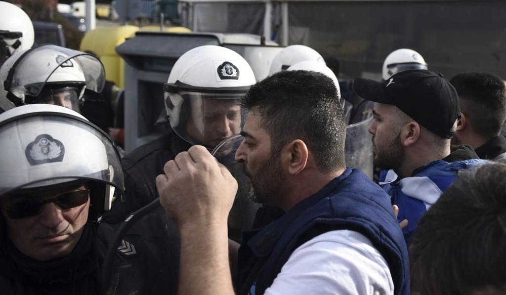 Opponents of Prespa Agreement argue with riot police during a protest in Evzones at the Greek-Macedonian border on Thursday. Photo: AP Photo Opponents of Prespa Agreement argue with riot police during a protest in Evzones at the Greek-Macedonian border on Thursday. Photo: AP Photo