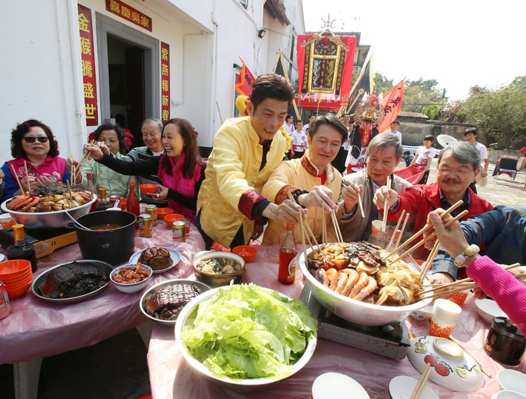 Villagers in Ng Ka, in Kam Tim, New Territories, in Hong Kong prepare to enjoy a poon choi feast to celebrate the Lunar New Year festival. Photo: David Poon.