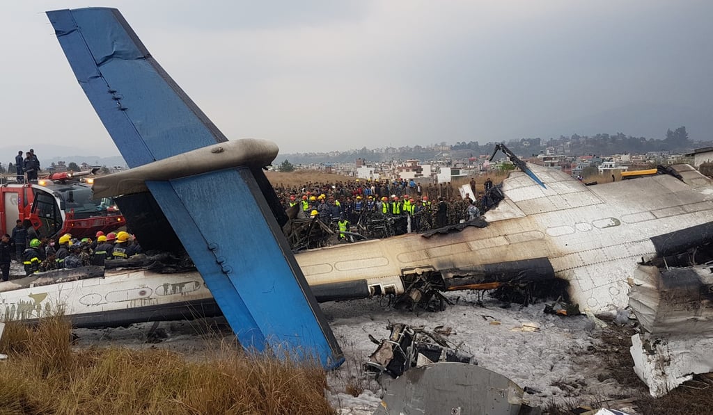 Rescuers work at the plane crash site in Kathmandu on March 12, 2018. Photo: Xinhua