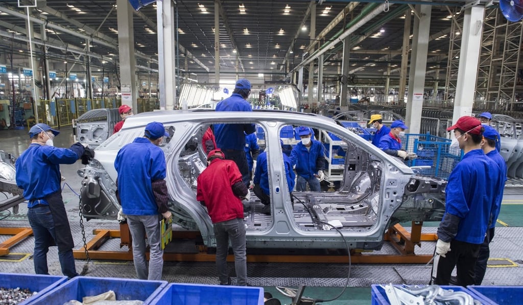 Workers at BYD’s main electric car factory, in Shenzhen, China. Photo: Zigor Aldama