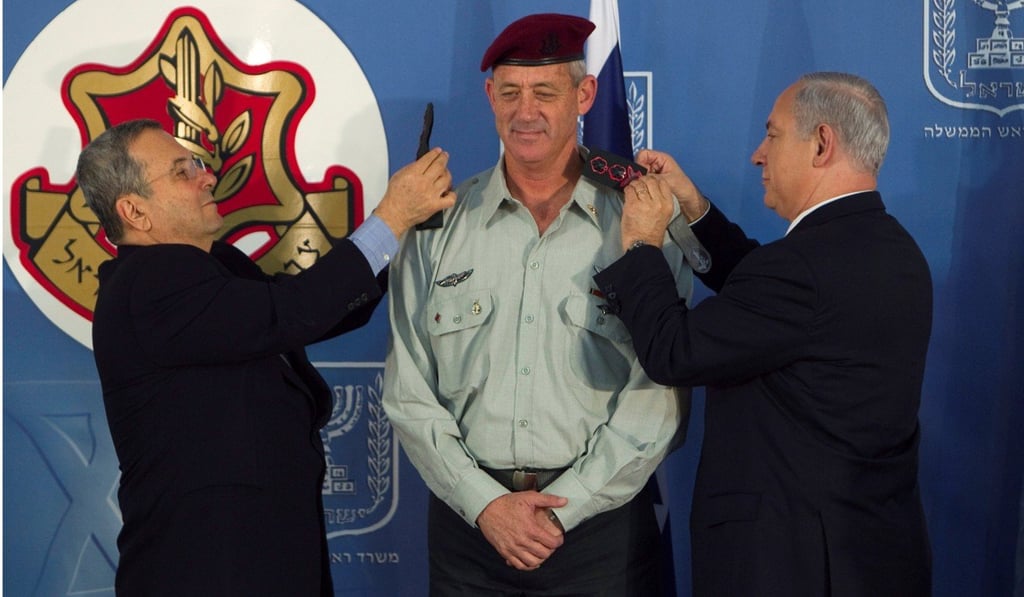 Israel’s Prime Minister Benjamin Netanyahu and Defence Minister Ehud Barak change the epaulettes of Gantz when he became chief of staff. Photo: Reuters
