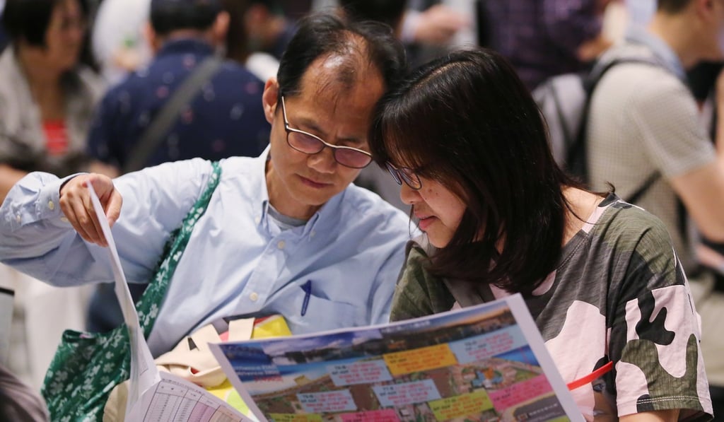 Potential buyers at the sales office of Cheung Kong Property’s Ocean Pride project at the Fortune Metropolis in Hung Hom in May 2017. Photo: Edward Wong