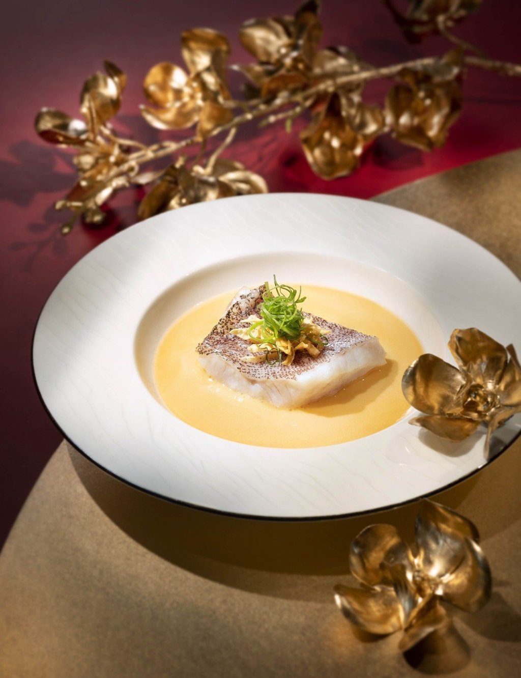 Simmered grouper fillet in superior broth served at Lai Heen at the Ritz-Carlton, Macau Simmered grouper fillet in superior broth served at Lai Heen at the Ritz-Carlton, Macau