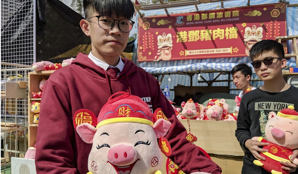 Jerry Ng (left), 17, running a booth with his classmates. Photo: Sum Lok-kei