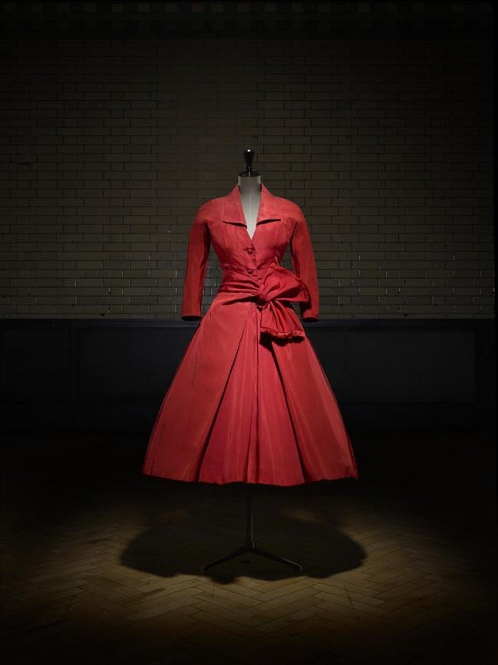 The Ecarlate afternoon dress from Dior’s autumn/winter 1955 haute couture collection at the Victoria and Albert Museum, London. Photo: Laziz Hamani