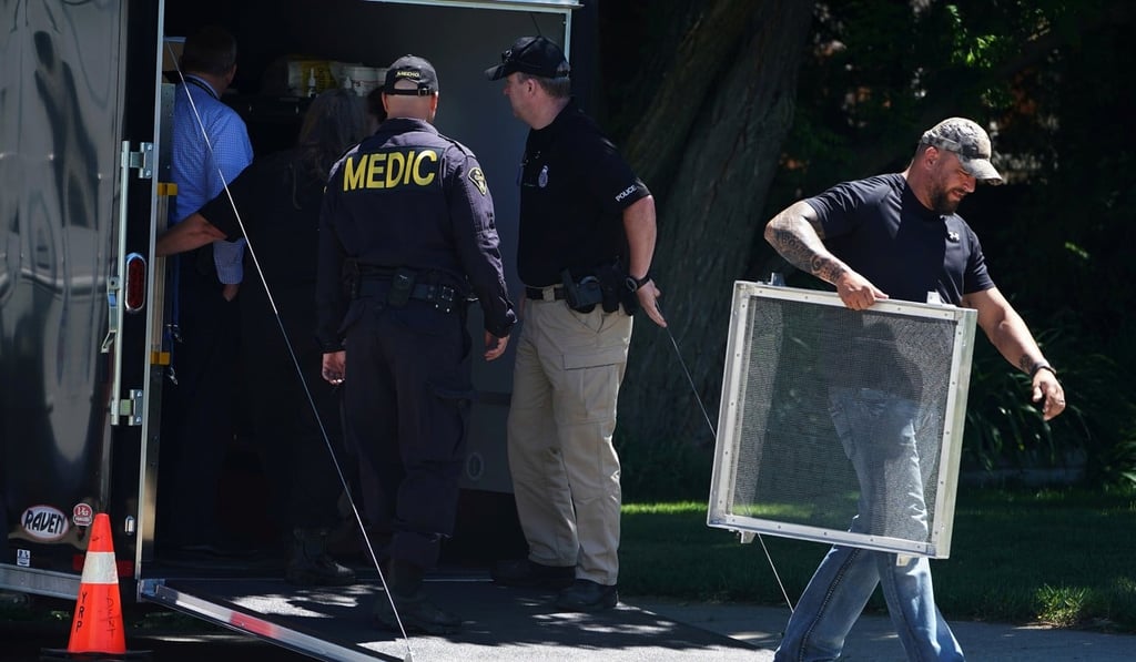 Police unload equipment as they continue to investigate a home that Bruce McArthur worked at in Toronto on July 5. Photo: Reuters