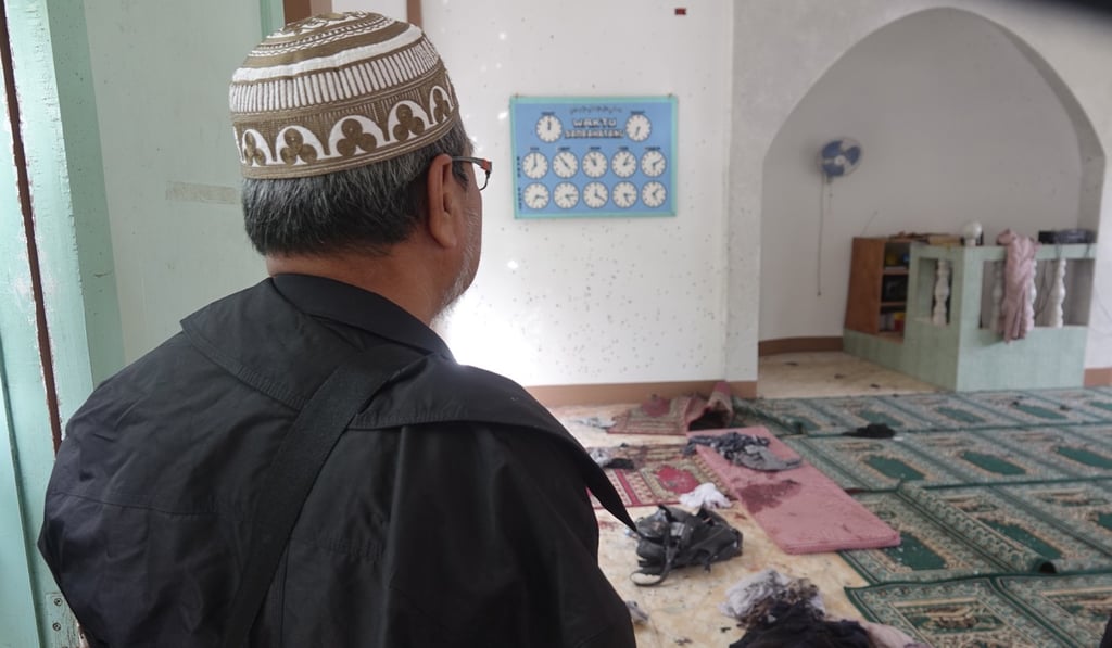 A resident at the mosque. Photo: EPA