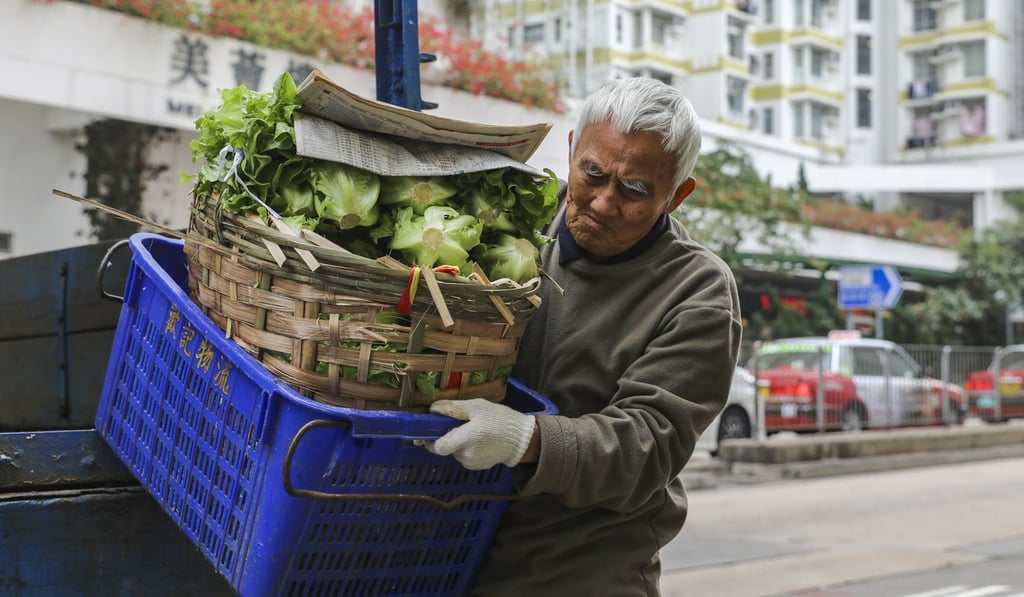 An elderly man unloads vegetables in Shek Kip Mei. Photo: Sam Tsang