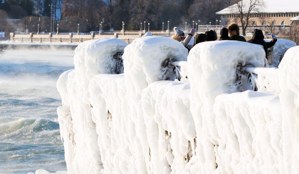 Tourists taking pictures of the Canadian Horseshoe falls in Niagara Falls, Ontario, Canada, on Thursday. Photo: AFP