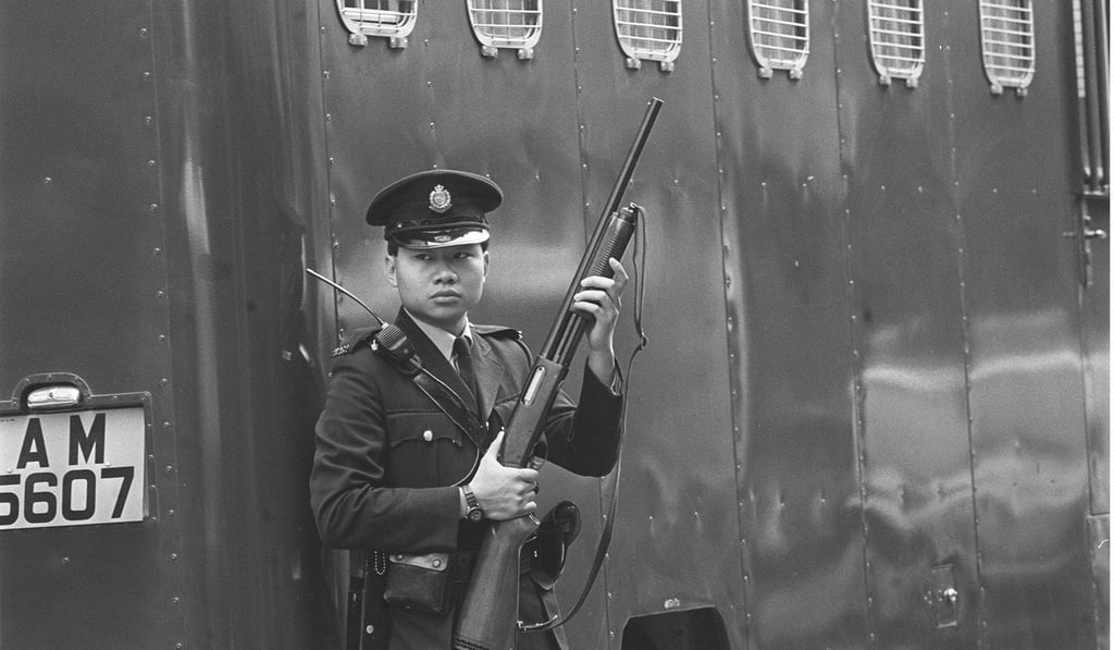 A police officer in Causeway Bay as the judge and jury visit the crime scene. Picture: SCMP