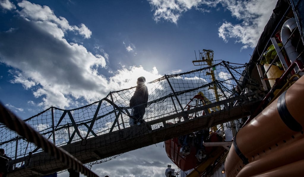 A migrant disembarks from the Dutch-flagged Sea Watch 3 NGO rescue vessel. Photo: AFP