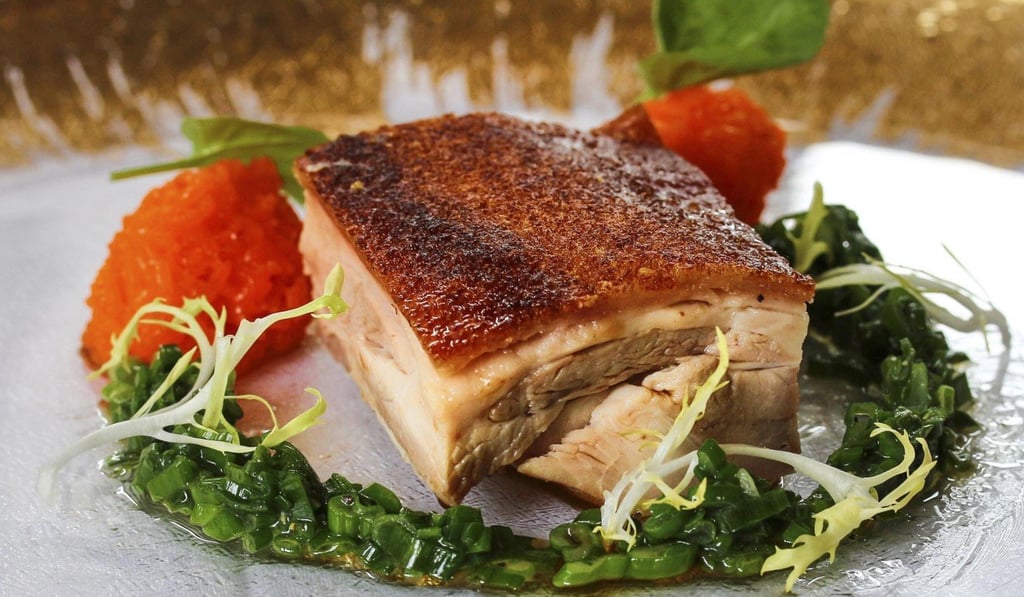 Eight-hour massaged suckling pig, part of the US$198 menu at Crustacean, in Los Angeles. Photo: Crustacean