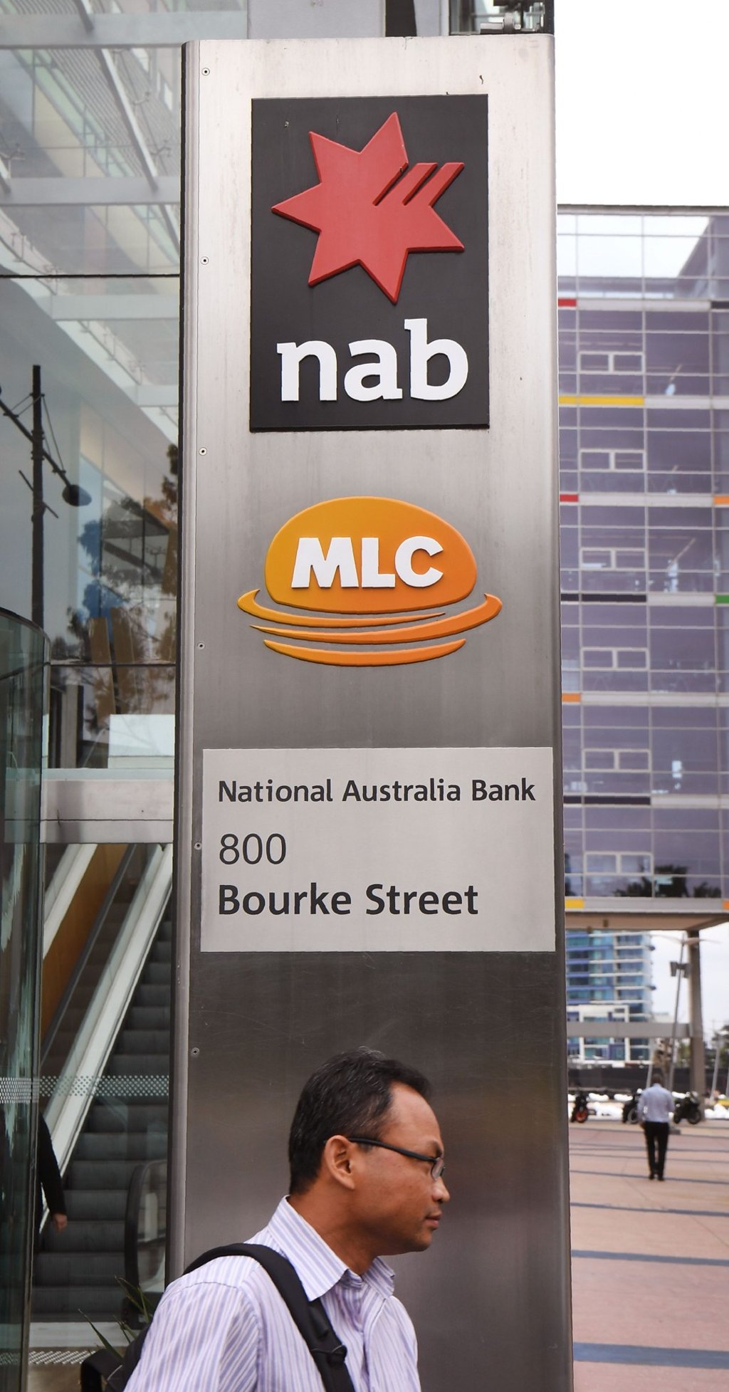 A man walks past the headquarters of the National Australia Bank in Melbourne. Australian banks admitted to failing customers and vowed to ‘reset’ their industry ahead of a crunch report into financial abuses in the sector. Photo: AFP A man walks past the headquarters of the National Australia Bank in Melbourne. Australian banks admitted to failing customers and vowed to ‘reset’ their industry ahead of a crunch report into financial abuses in the sector. Photo: AFP
