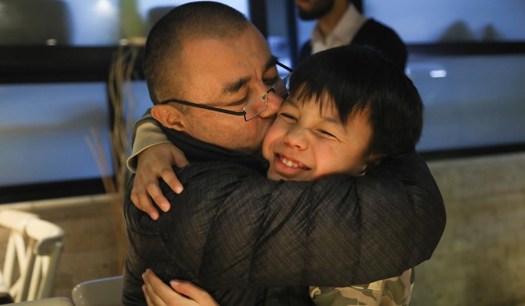 Kerem Mamut embraces his son Babur, whom he did not see during his three-month detention. Photo: Helene Franchineau Kerem Mamut embraces his son Babur, whom he did not see during his three-month detention. Photo: Helene Franchineau